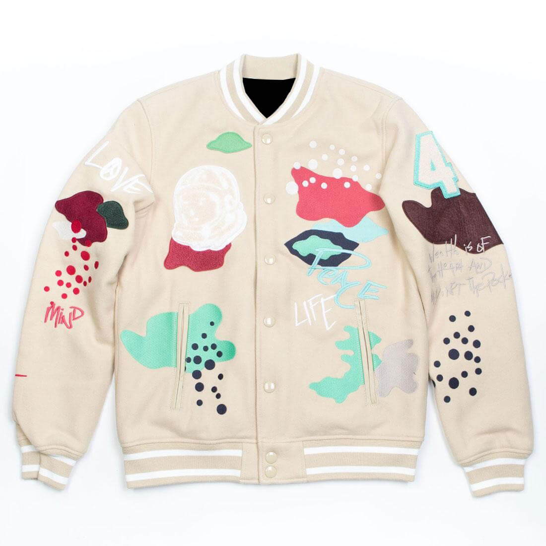 Cream Billionaire Boys Club varsity jacket with colorful abstract patches and graphic prints