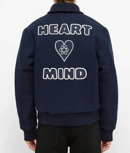 Back view of navy Billionaire Boys Club Heart Mind varsity jacket with white lettering and heart logo