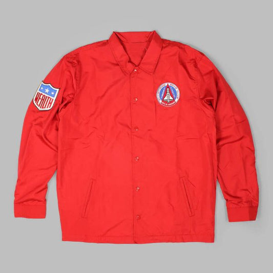Red Billionaire Boys Club coach jacket with front logo patch and left sleeve shield patch