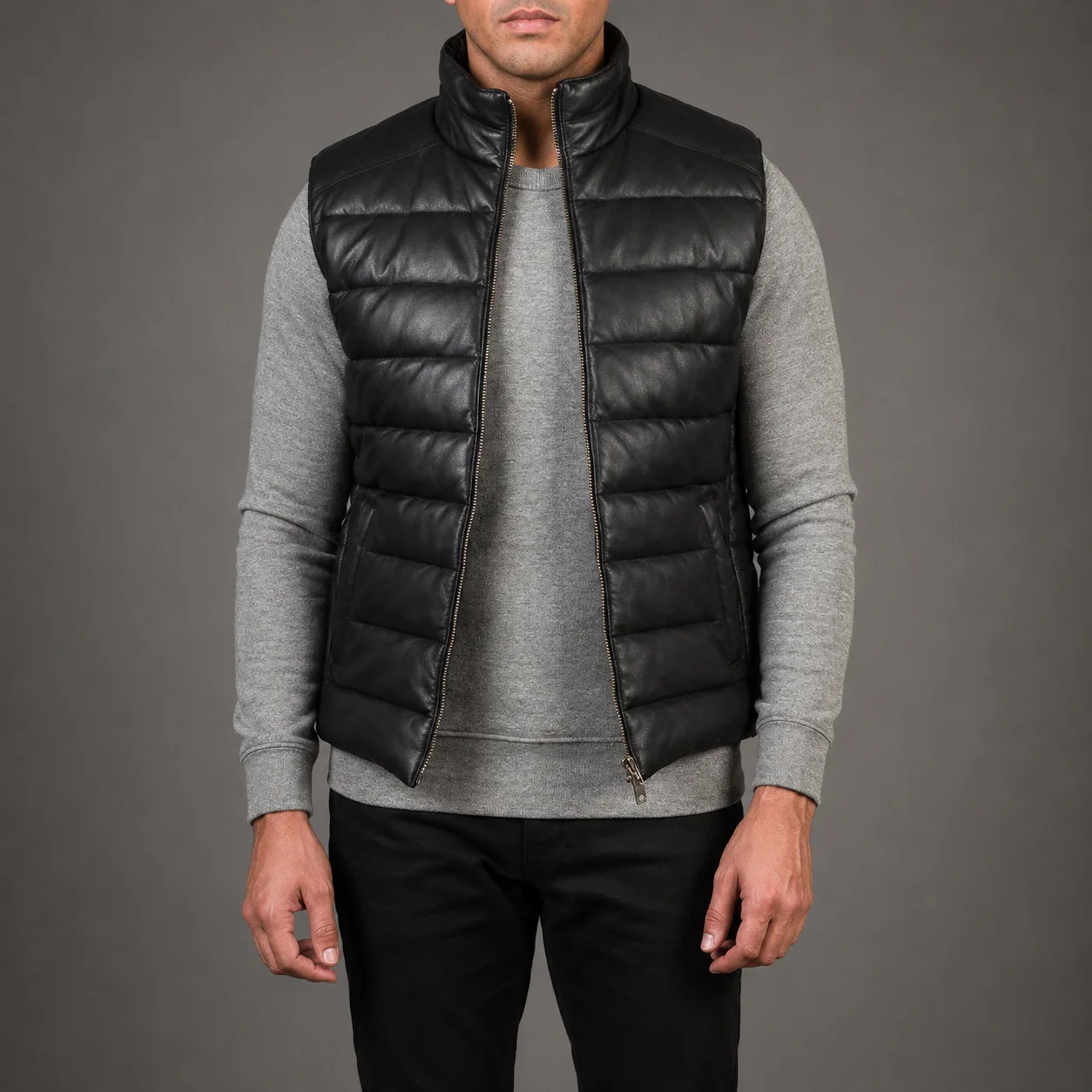 Men's Emerson black leather puffer vest crafted from premium genuine leather featuring lightweight quilted insulation, sleek black finish, sleeveless design, durable construction, and modern everyday winter style by Jonny N Guys