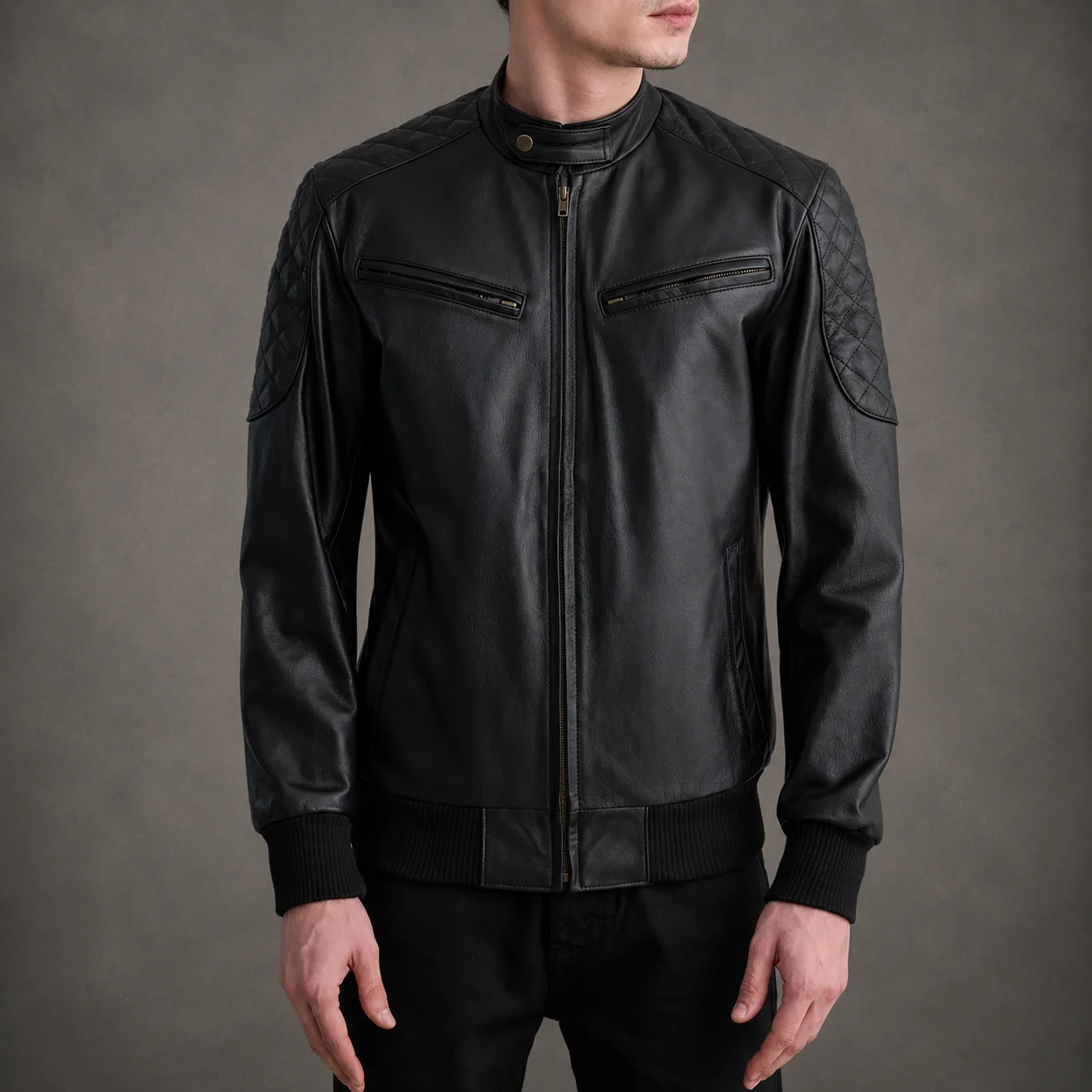 Men's Grayson black leather bomber jacket crafted from premium genuine leather featuring a sleek black finish, classic bomber silhouette, ribbed cuffs and hem, durable construction, and timeless everyday style by Jonny N Guys