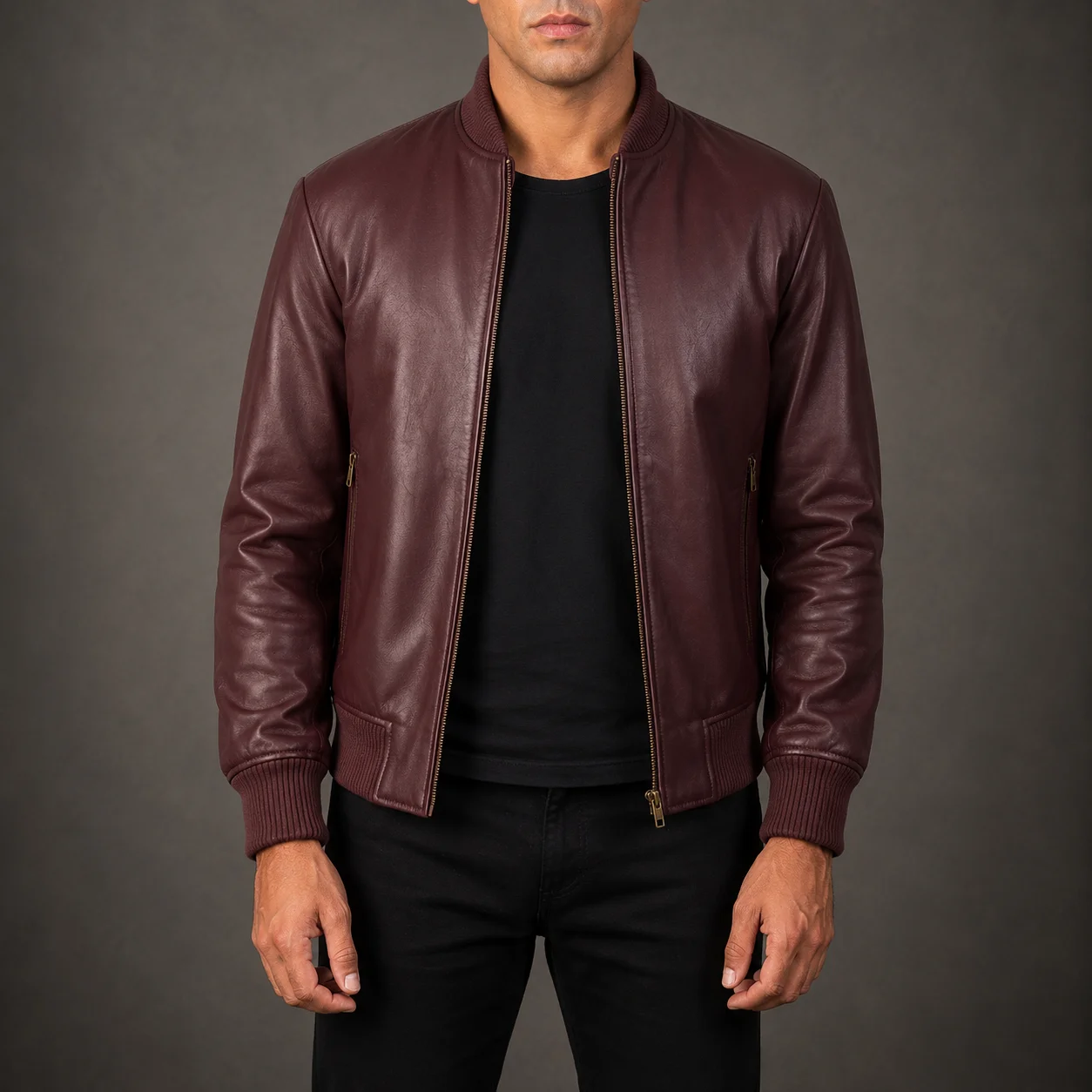 Men's Ashton Maroon Leather Bomber Jacket crafted from premium genuine leather featuring a rich maroon finish, classic bomber silhouette, ribbed cuffs, durable construction, and refined everyday style by Jonny N Guys
