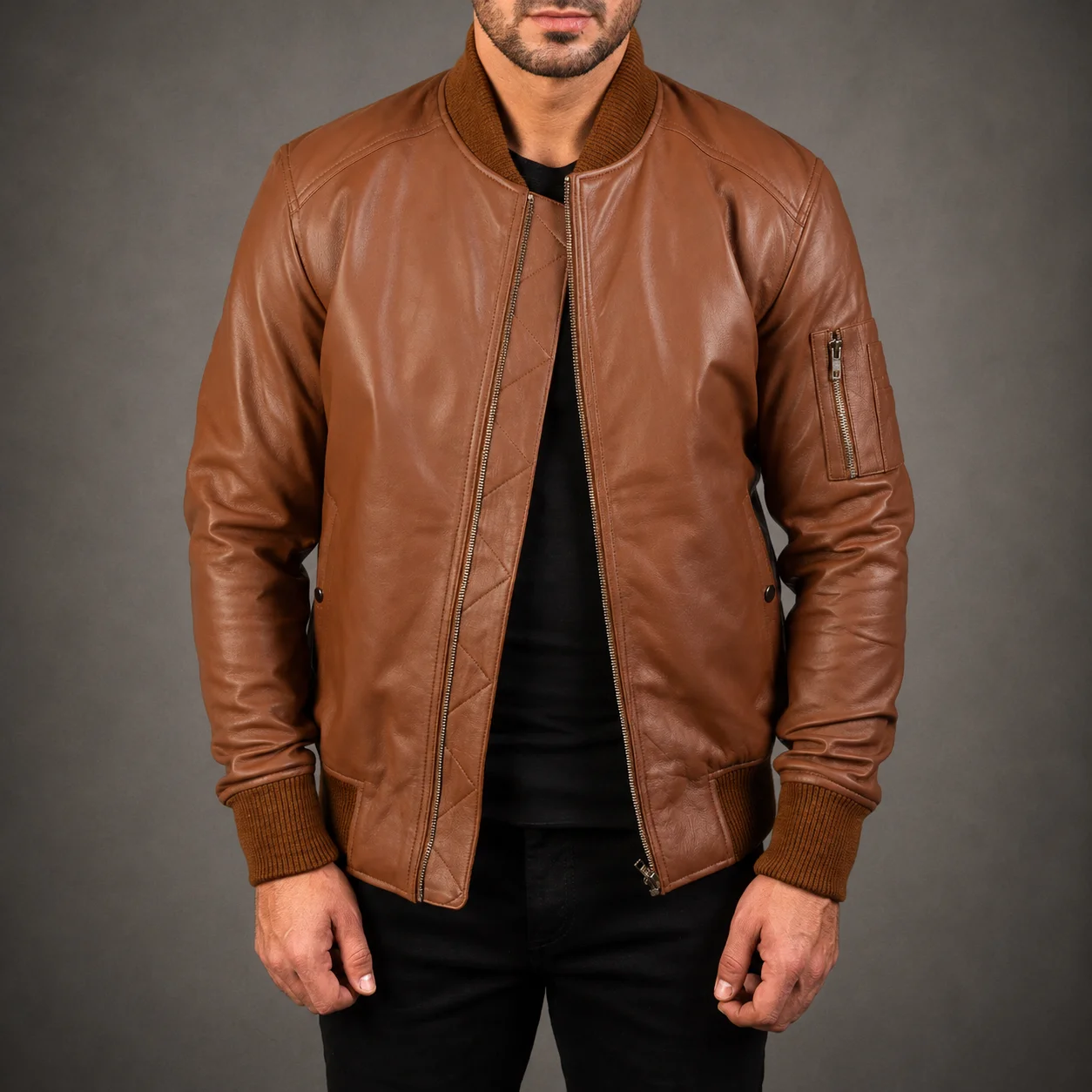 Men's Easton MA-1 brown leather bomber jacket crafted from premium genuine leather featuring a classic military-inspired MA-1 silhouette, rich brown finish, ribbed trims, durable construction, and timeless everyday style by Jonny N Guys